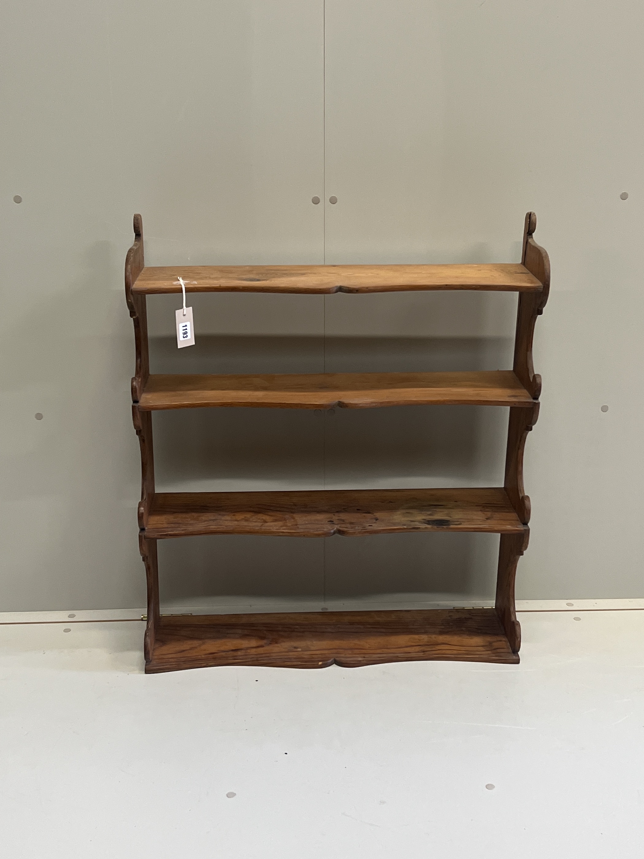 A Victorian pitch pine four tier wall bracket, width 75cm, depth 21cm, height 87cm